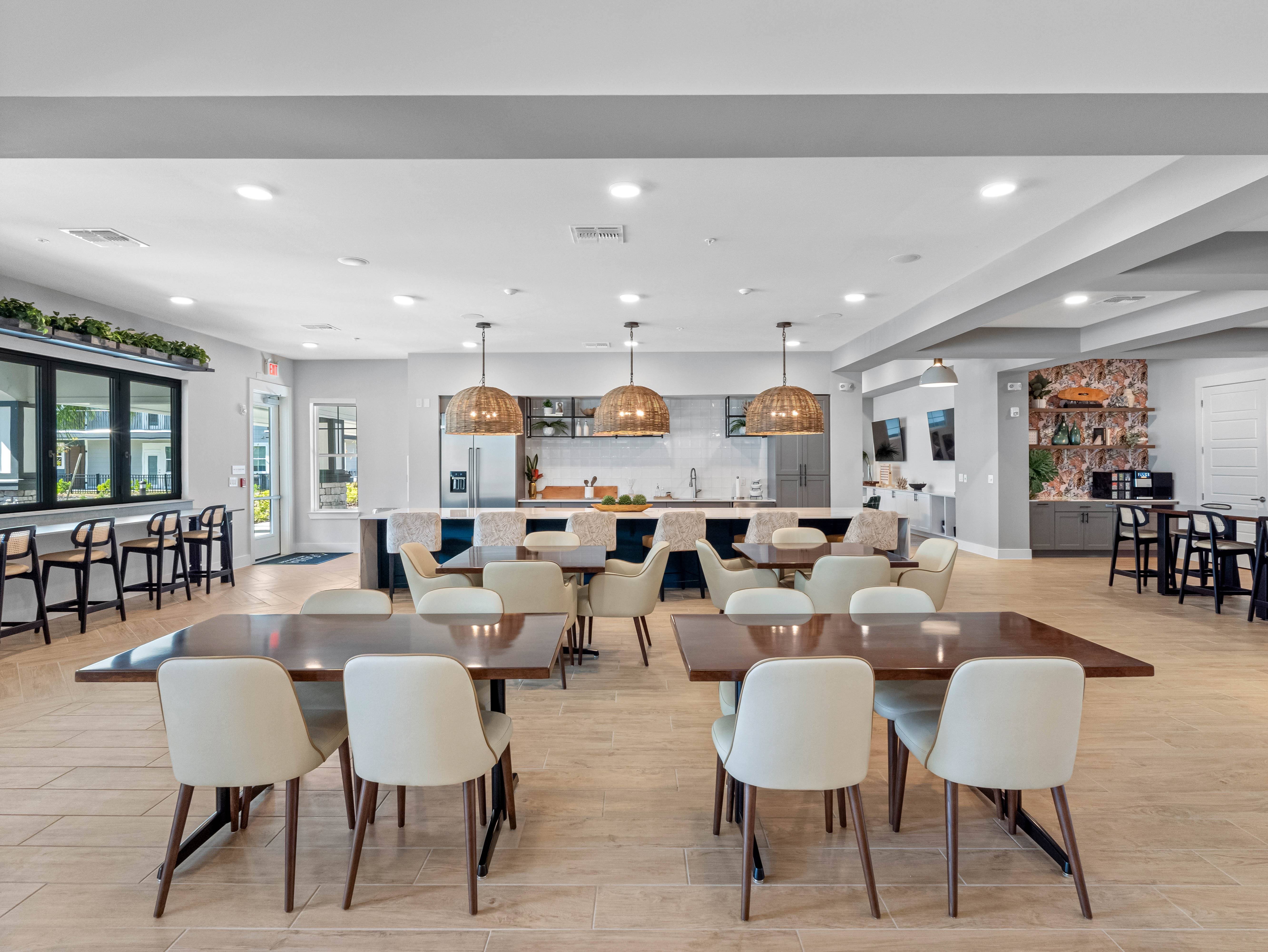 A modern dining room with a large table and chairs.